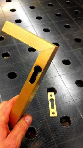 A finished brass angle on the fixture table