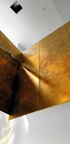 Brass panels at the soffit edge