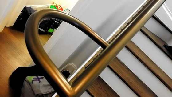 Bronze-finish handrail return