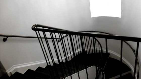 Curved stair with a steel picket guard