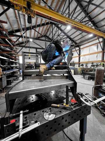 Welding a frame under the crane