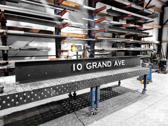 Steel address sign on the fixture table