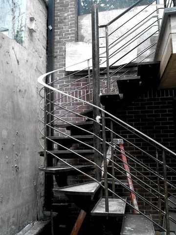 Exterior spiral stair in a courtyard