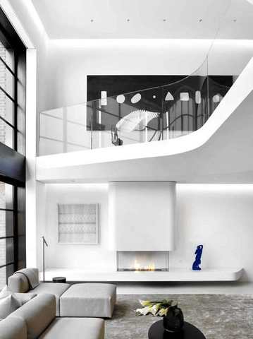 Curved stair guard in a double-height loft