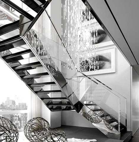 Open steel stair with glass guard
