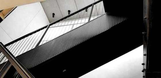 Straight steel stair with a picket guard