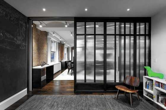 Black steel and glass partition in a residence