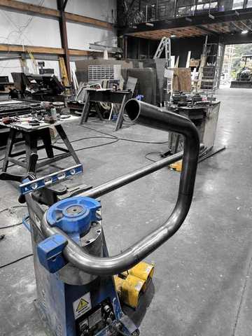 Tube bender with a freshly bent pipe