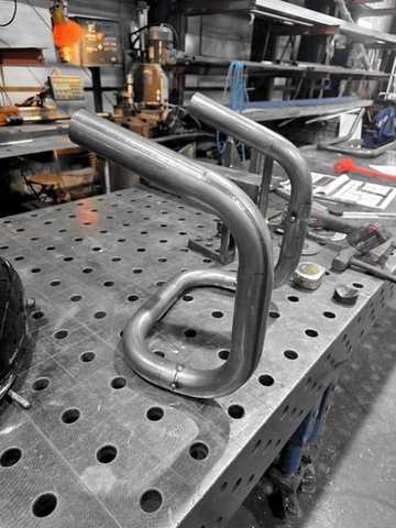 Large-radius bent tubes staged on the table